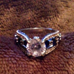 NWOT Beautiful silver ring with lab created sapphires and 1k cz. 925 stamped